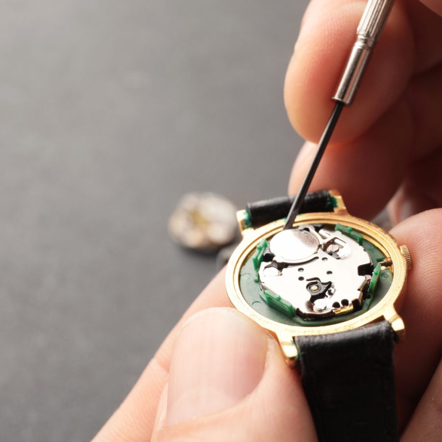 Clockmaker,Repairing,Broken,Watch,At,Table,,Closeup